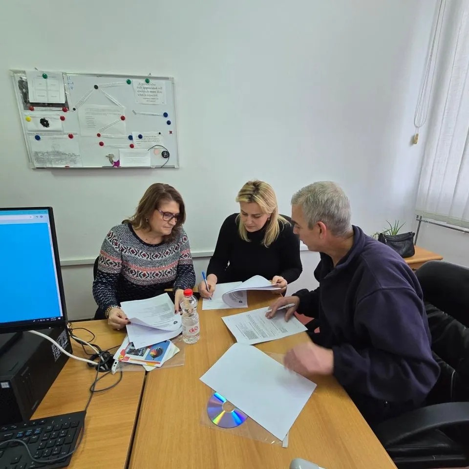 May be an image of 3 people, people studying and text