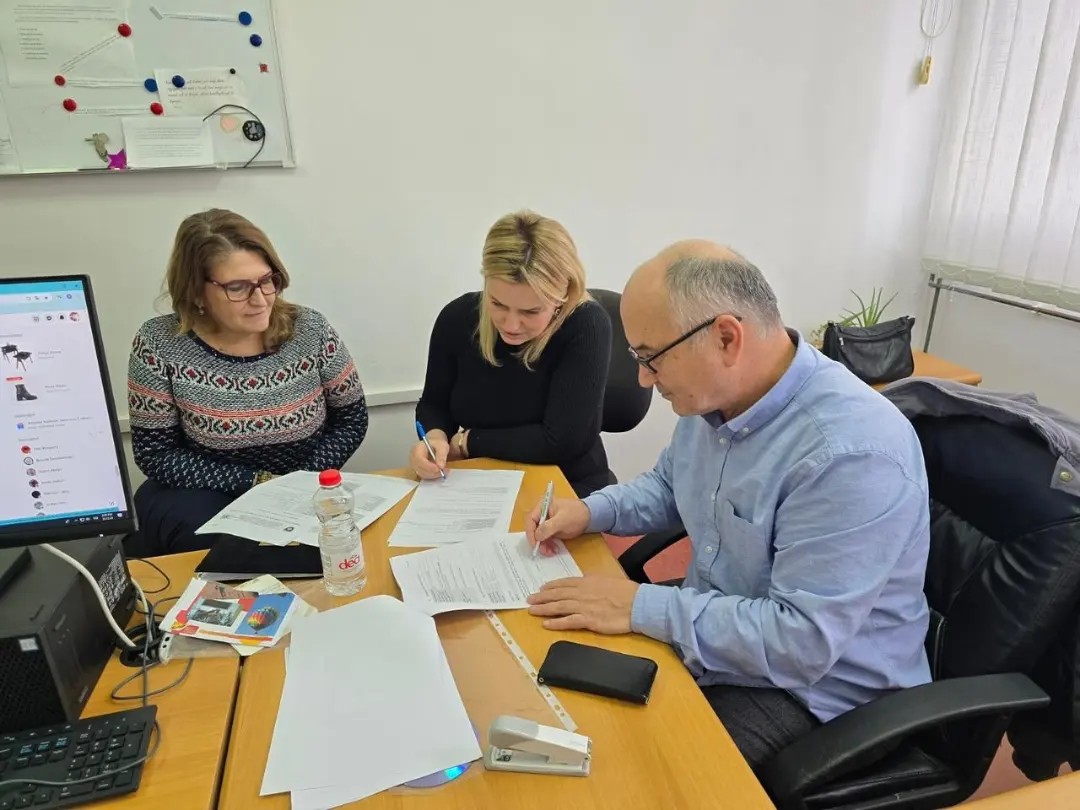 May be an image of 3 people, people studying and text
